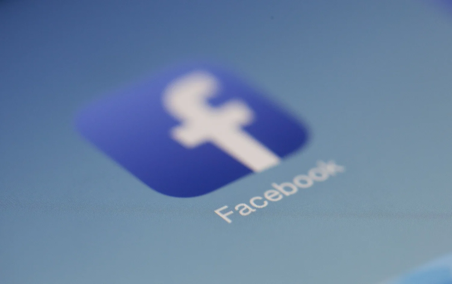 The Facebook logo on a phone screen