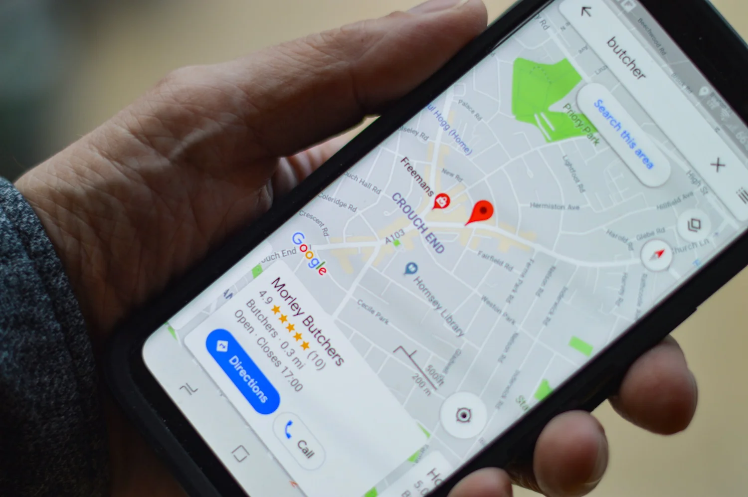 A customer using a map on their phone to find a local business